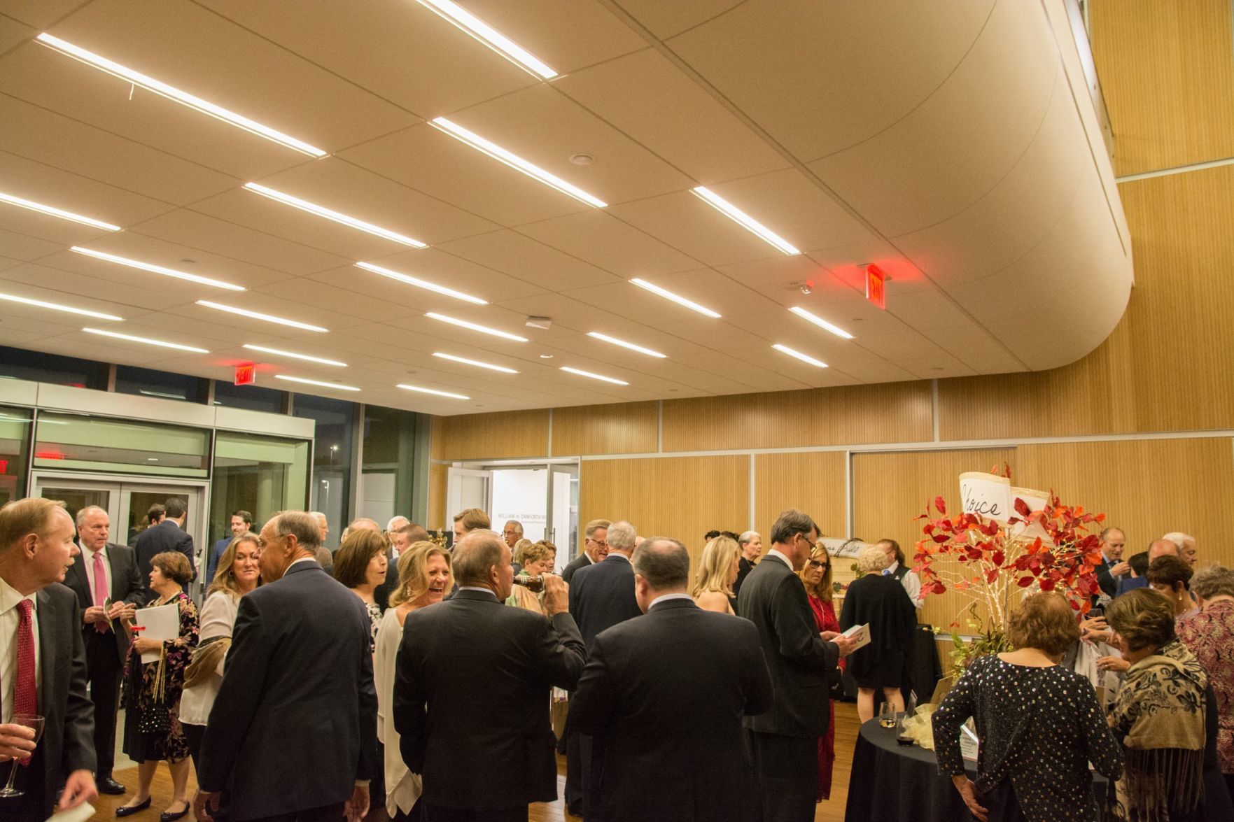Guests enjoy cocktail hour in the lounge of the event